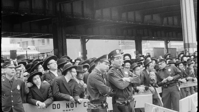 Satmar chassidim wait behind police as the Queen Mary comes into New York, August 31, 1965